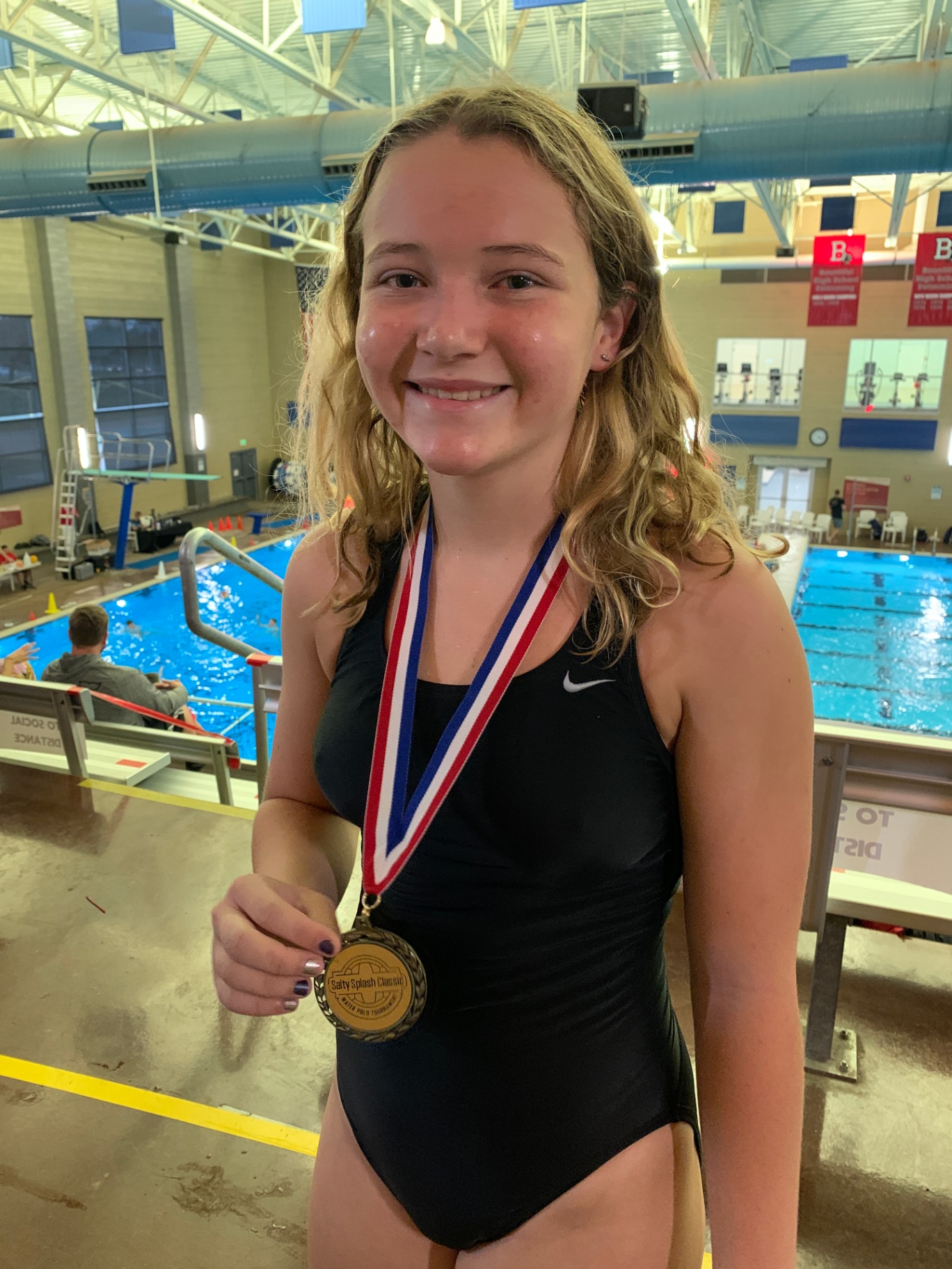 Indi with a gold medal at the pool