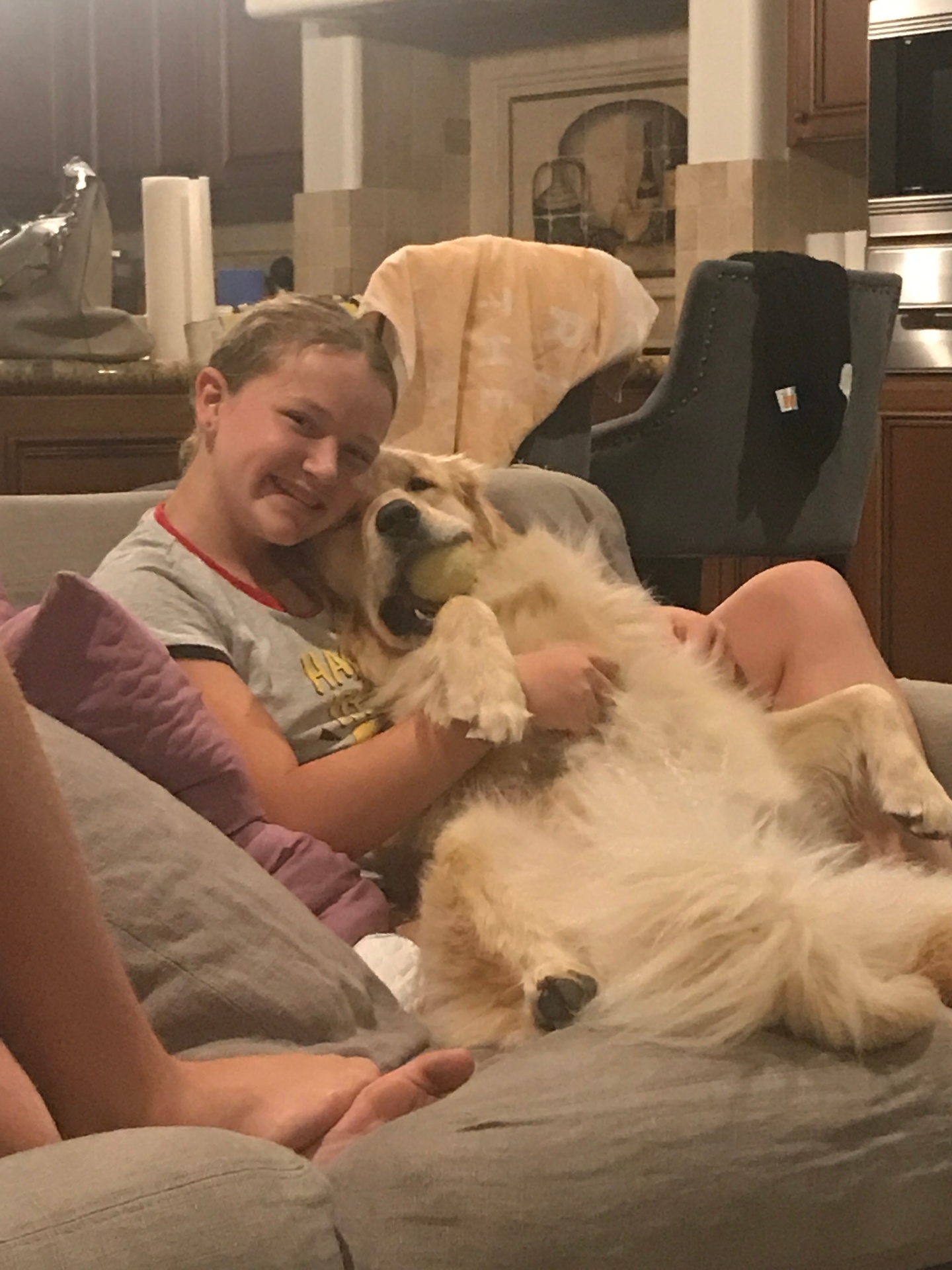 Indi cuddling the family dog