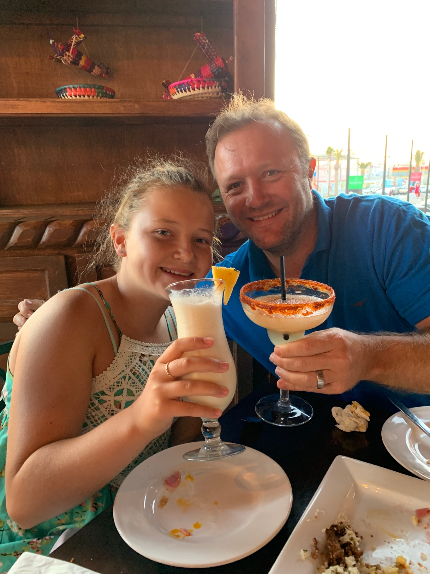 Indi and dad toasting in Mexico
