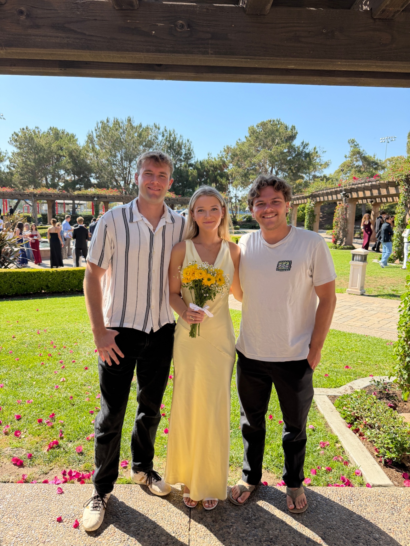 Indi at graduation with her brothers
