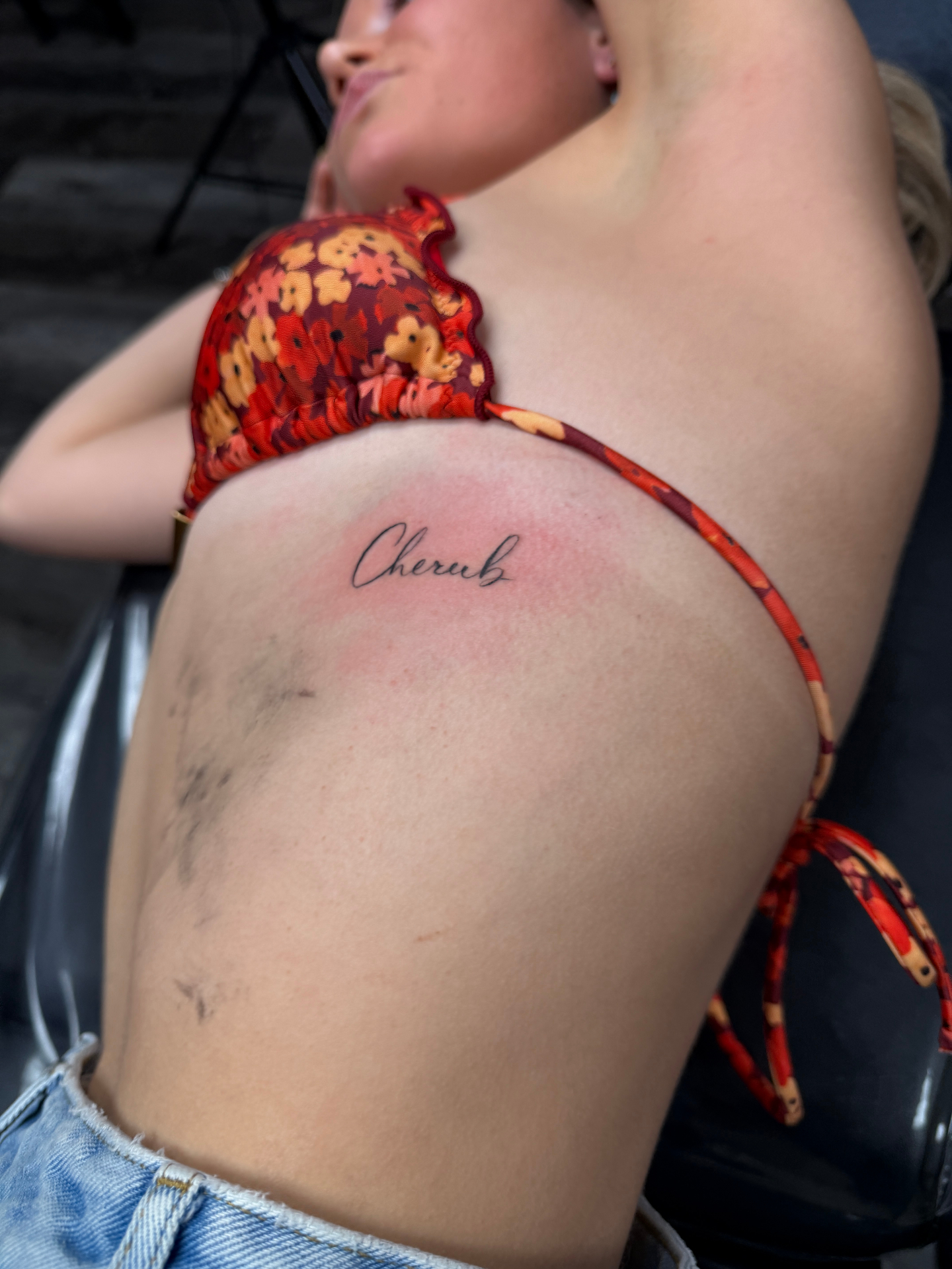 Indi showing off her cherub tattoo