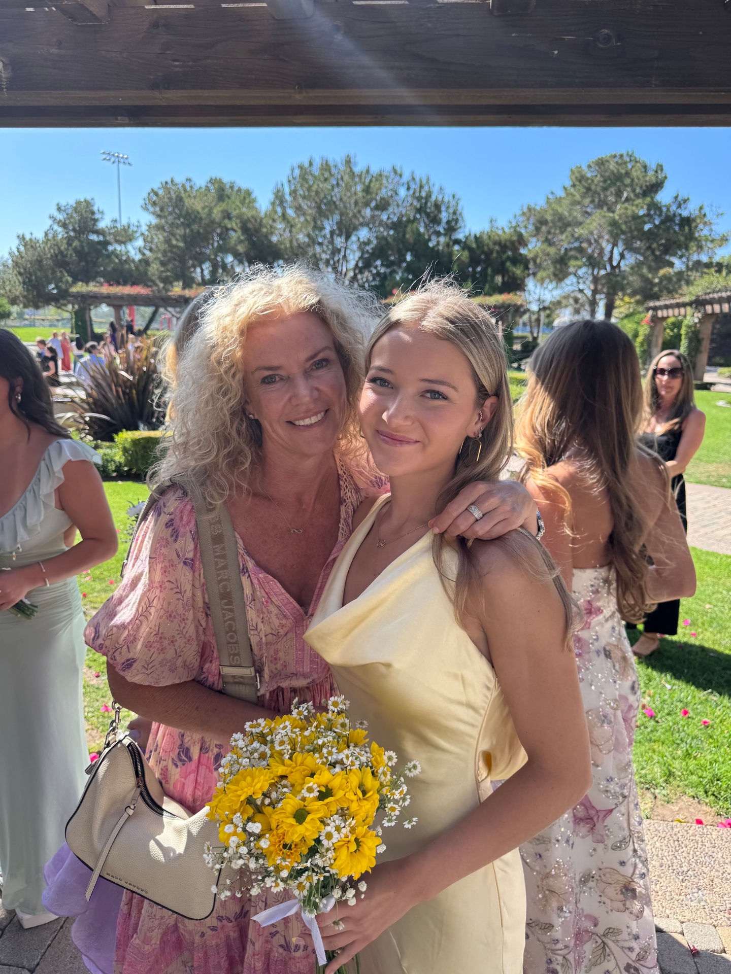 Indi with mom at a wedding