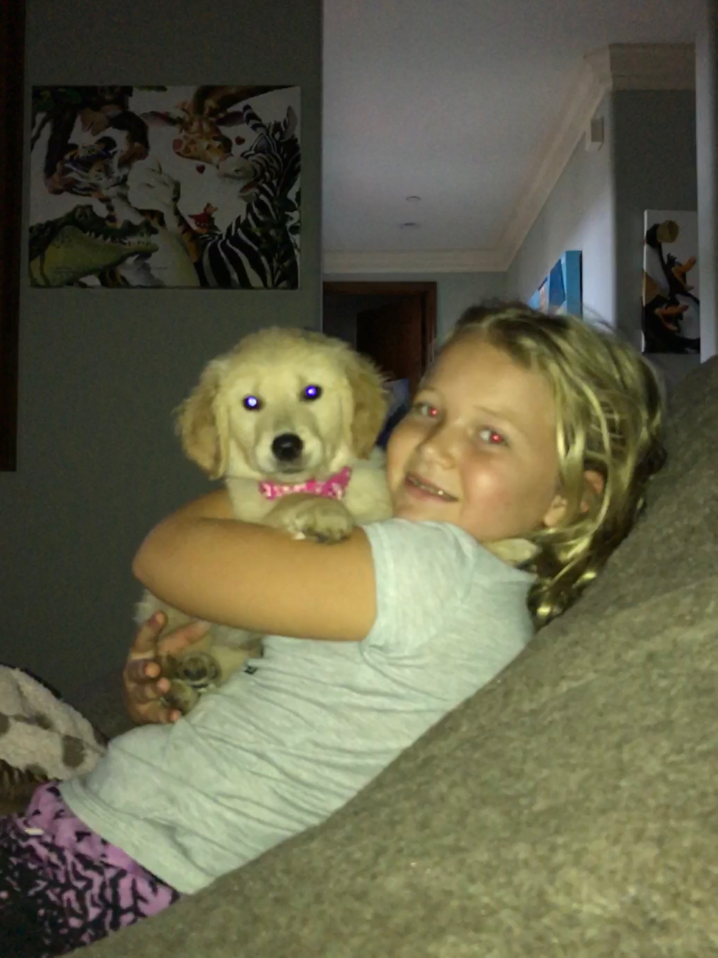 Indi cuddling a puppy