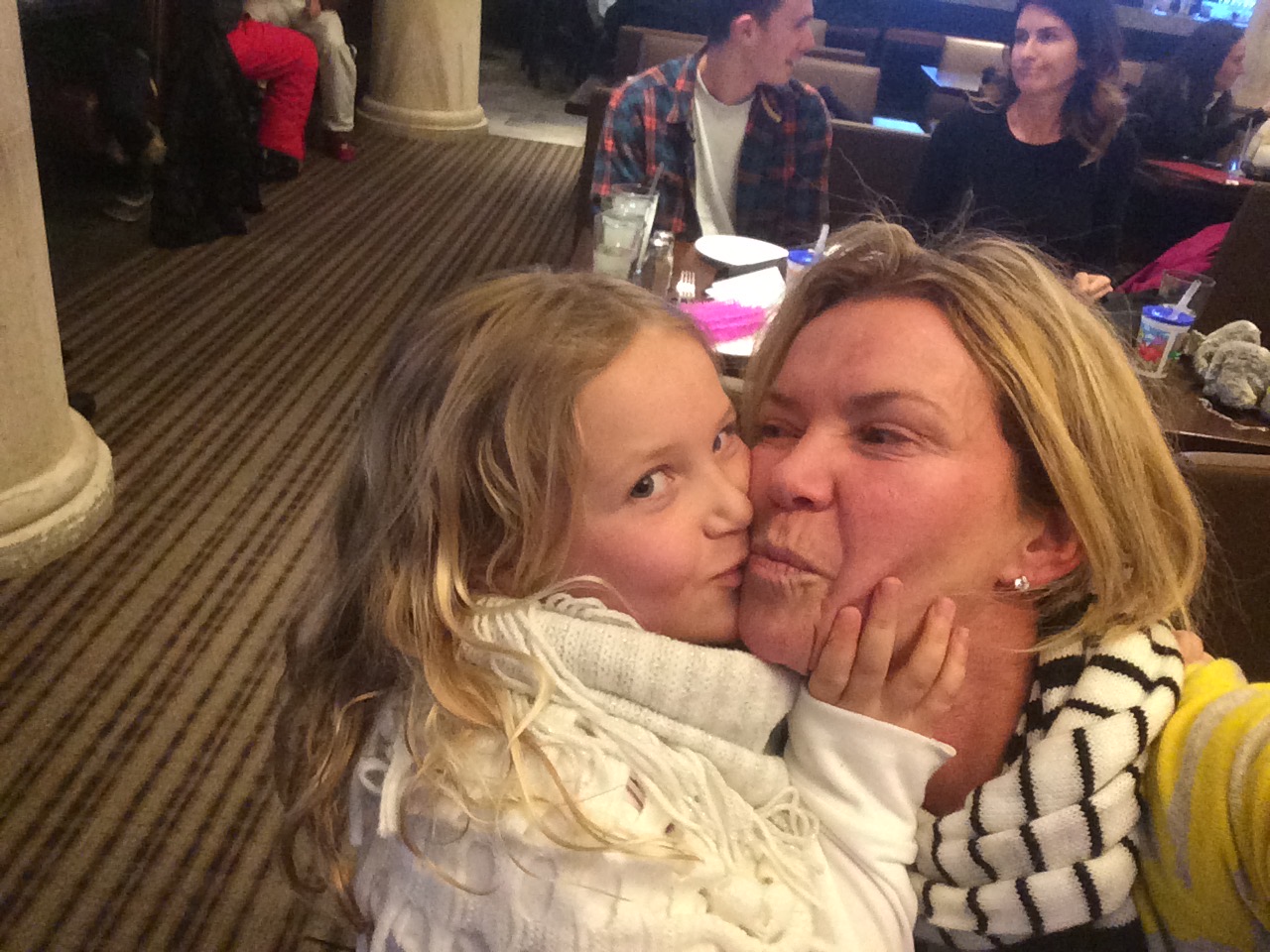 Indi squishing cheeks with mom